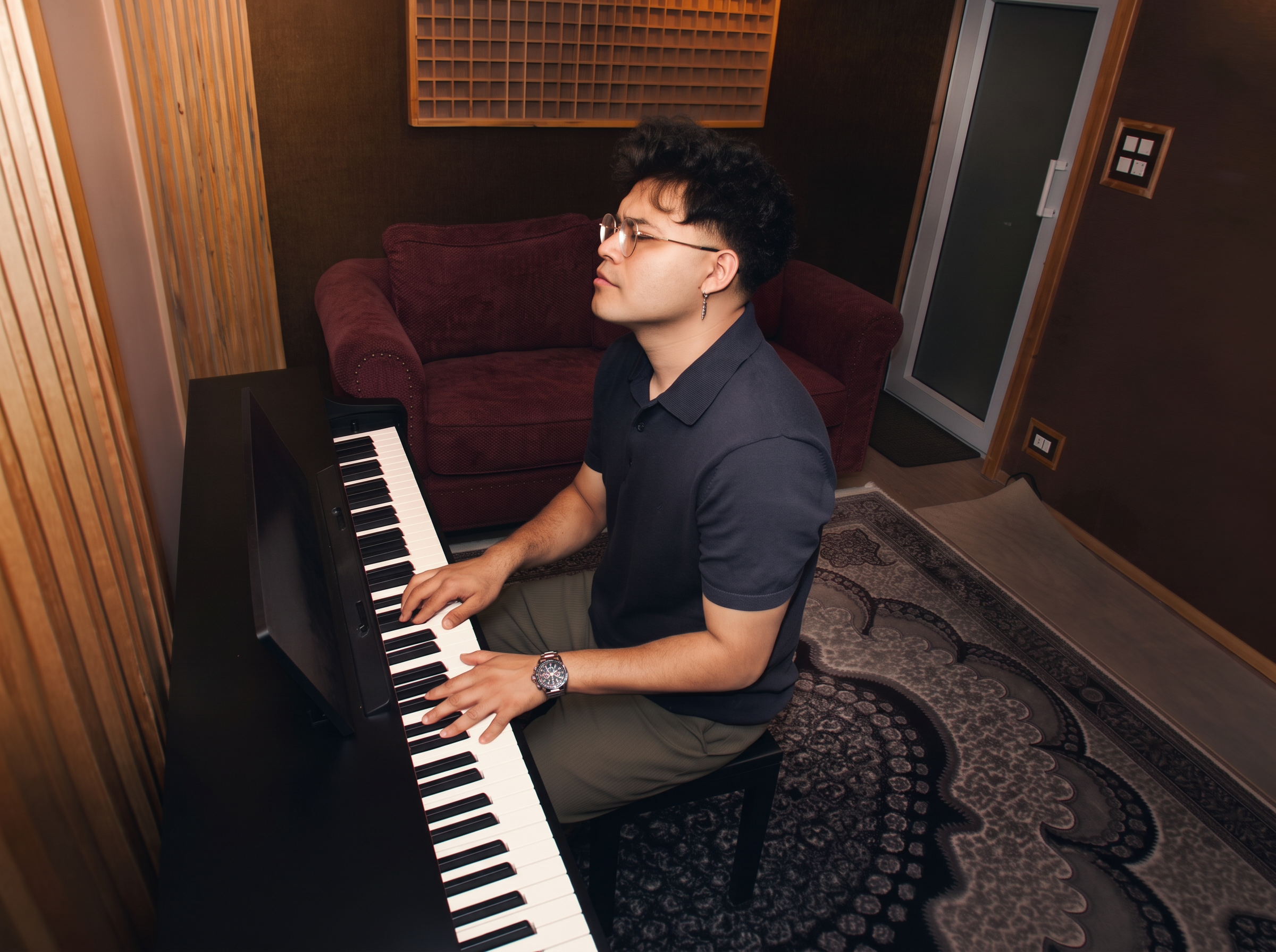 Utpal Kandel at the piano in his studio